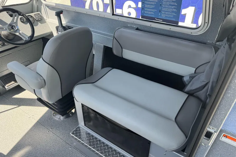 Slide: The Image of Interior of 2027 KingFisher 2025 Escape HT boat with seating and steering wheel. - 24