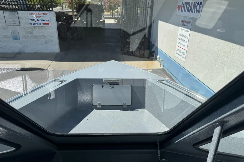 Slide: The Image of Interior view of 2027 KingFisher 2025 Escape HT boat at a service center. - 36