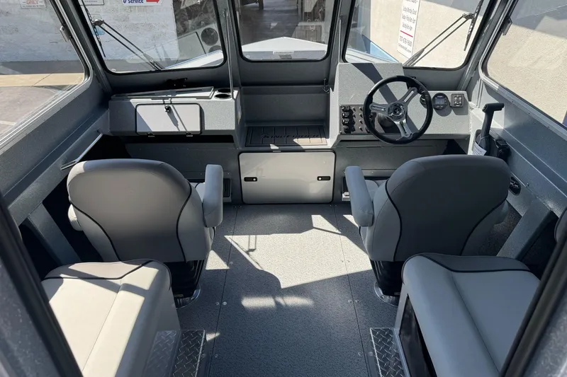 Slide: The Image of Interior of 2027 KingFisher 2025 Escape HT boat, featuring modern helm and seating. - 22