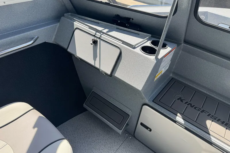 Slide: The Image of Interior of 2027 KingFisher 2025 Escape HT boat, featuring storage and cup holders. - 31