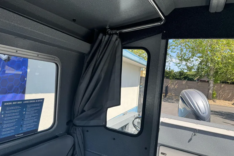Slide: The Image of Interior view of 2027 KingFisher 2025 Escape HT boat with curtain and window. - 27