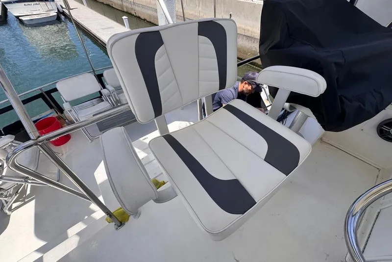 Slide: The Image of Captain's chair on 1982 Sunliner Ocean Yachts, docked at marina. - 15