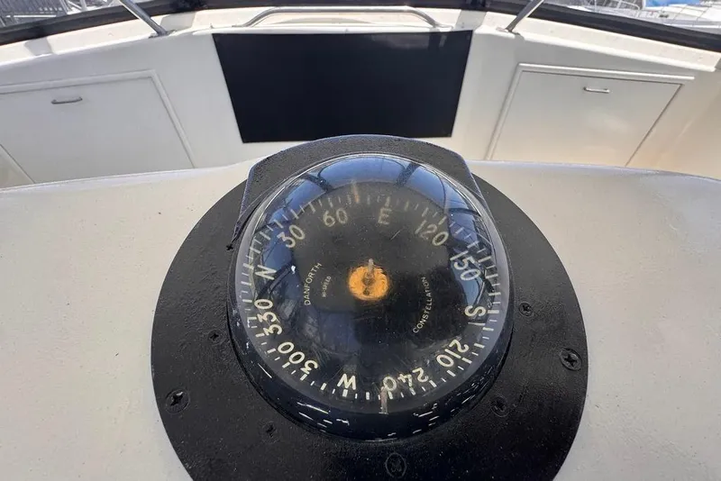 Slide: The Image of Compass on 1982 Sunliner Ocean Yachts, showcasing navigation equipment. - 18