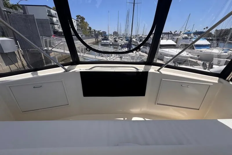 Slide: The Image of Interior view of 1982 Sunliner Ocean Yachts, overlooking marina with docked boats. - 19