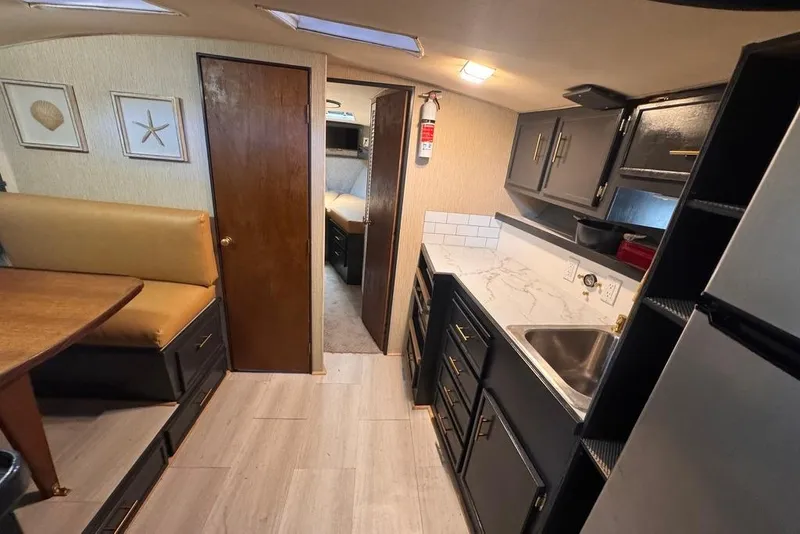 Slide: The Image of Interior of 1982 Sunliner Ocean Yachts with modern kitchen and cozy seating area. - 37