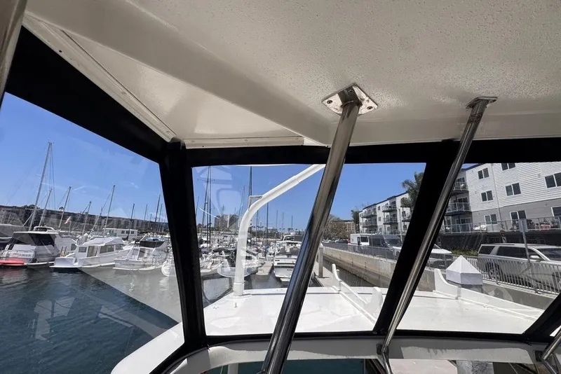 Slide: The Image of View from 1982 Sunliner Ocean Yachts, overlooking marina with boats and waterfront buildings. - 6