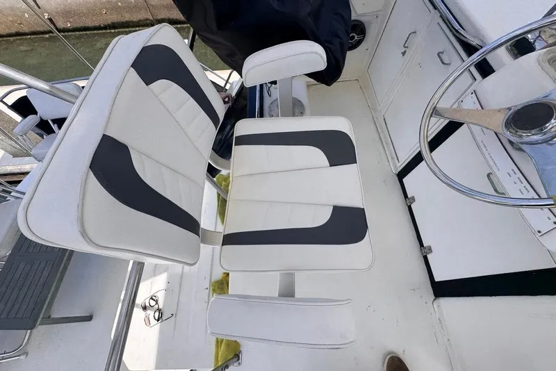 Slide: The Image of Captain's chair and steering wheel on 1982 Sunliner Ocean Yachts boat deck. - 7