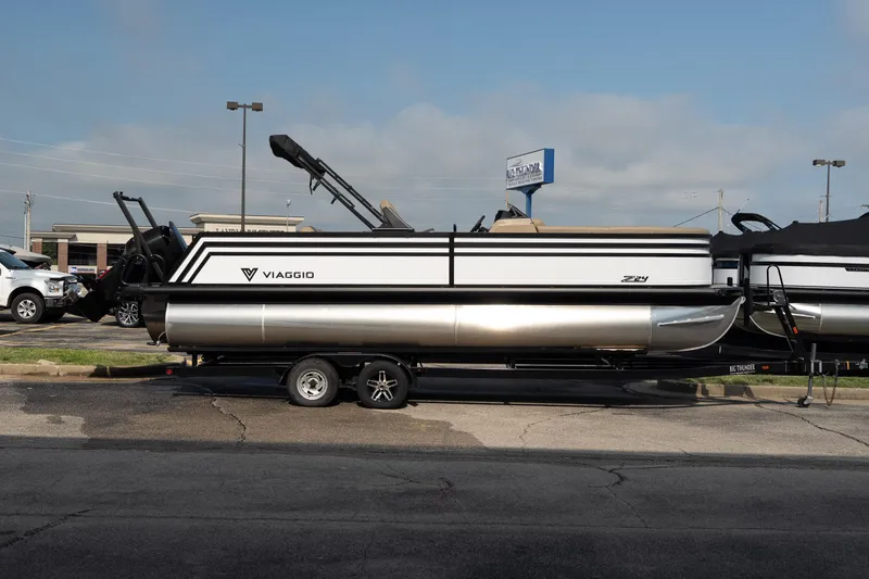 The Image of 2026 Viaggio Z24S pontoon boat on trailer in parking lot. - 1