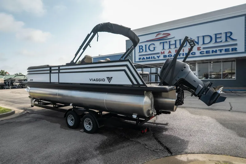 Slide: The Image of 2026 Viaggio Z24S pontoon boat on trailer at Big Thunder Marine dealership. - 11