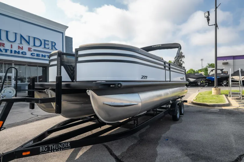 Slide: The Image of 2026 Viaggio Z24S pontoon boat on trailer at Big Thunder Marine dealership. - 13