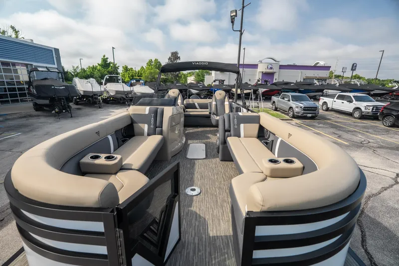 Slide: The Image of Luxurious 2026 Viaggio Z24S pontoon boat with spacious seating and modern design at a dealership. - 14