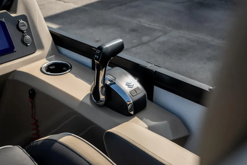 Slide: The Image of Control panel of 2026 Viaggio Z24S boat with throttle lever and cup holder. - 21