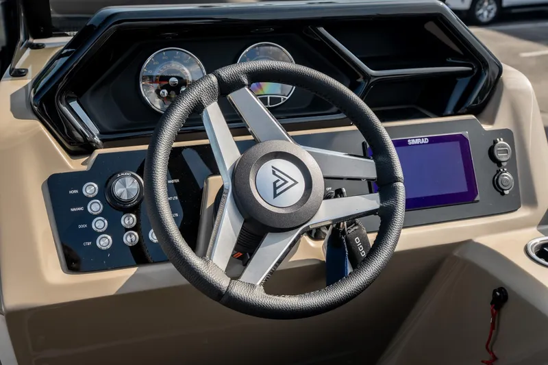 Slide: The Image of Steering wheel and dashboard of 2026 Viaggio Z24S boat with modern controls. - 22