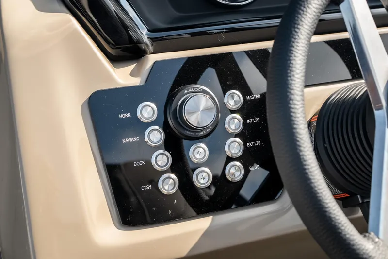 Slide: The Image of Control panel of 2026 Viaggio Z24S boat with buttons and steering wheel. - 23