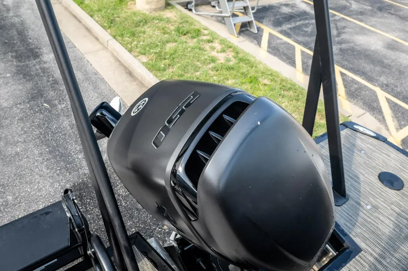 Slide: The Image of Outboard motor on a Viaggio Z24S boat, 2026 model, parked on pavement. - 28