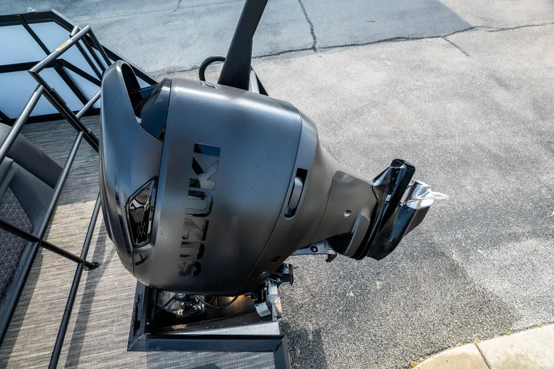 Slide: The Image of ```json { "alt_text": "Suzuki outboard motor on Viaggio Z24S, 2026 model." } ``` - 33