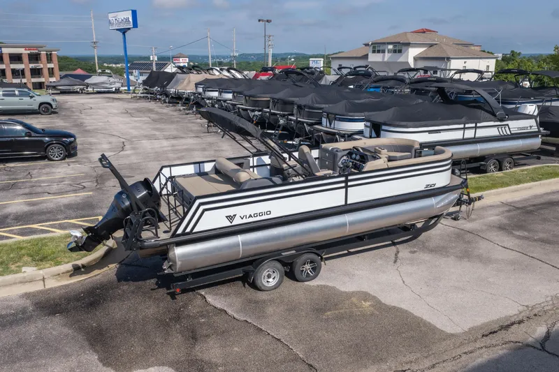 Slide: The Image of 2026 Viaggio Z24S pontoon boat on trailer in dealership parking lot. - 39