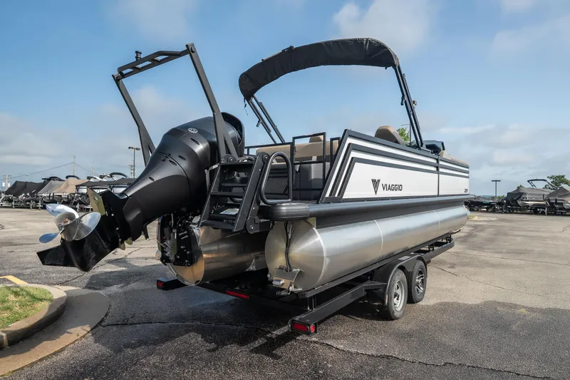 Slide: The Image of 2026 Viaggio Z24S pontoon boat on trailer, featuring sleek design and powerful outboard motor. - 7