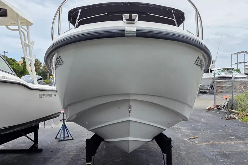 Slide: The Image of Front view of a 2000 Boston Whaler 21 Ventura boat on a trailer. - 3