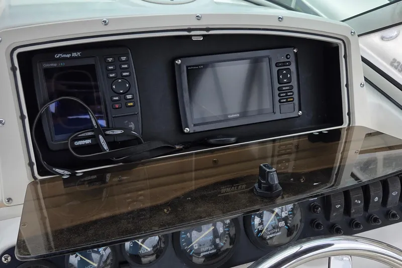 Slide: The Image of Dashboard of a 2000 Boston Whaler 21 Ventura with Garmin GPS devices. - 10