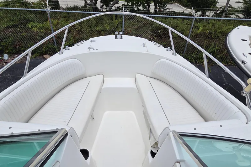 Slide: The Image of Boston Whaler 21 Ventura 2000 boat interior with white seating and open bow design. - 7