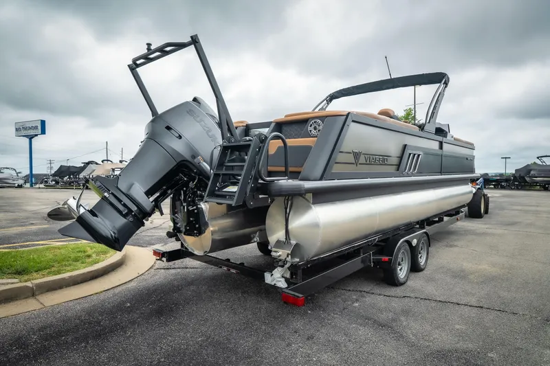 Slide: The Image of 2026 Viaggio Diamante UWA 26 pontoon boat on trailer, featuring powerful outboard motor. - 8