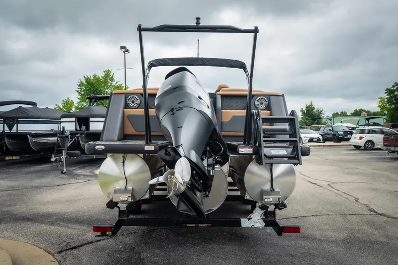 Slide: The Image of 2026 Viaggio Diamante UWA 26 pontoon boat, rear view, parked on trailer, overcast sky. - 9
