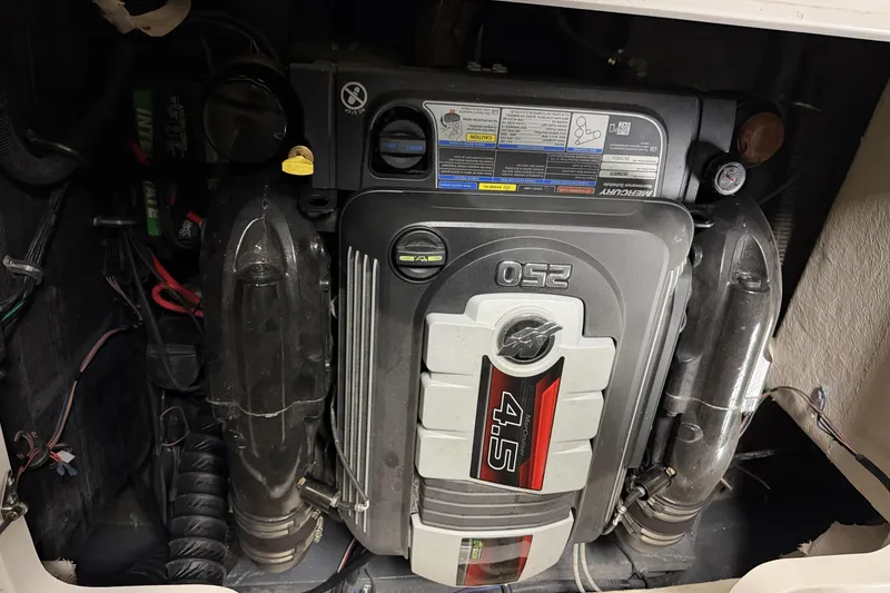 Slide: The Image of Engine compartment of a 2022 Starcraft Star Step 221 I/O boat, featuring a Mercury 4.5 engine. - 4