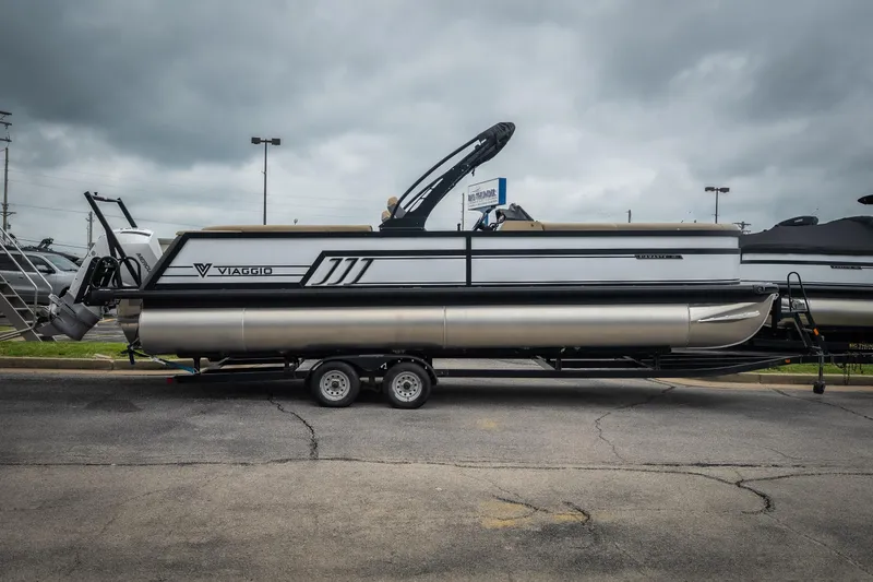 The Image of 2026 Viaggio D26U pontoon boat on trailer under cloudy sky. - 1