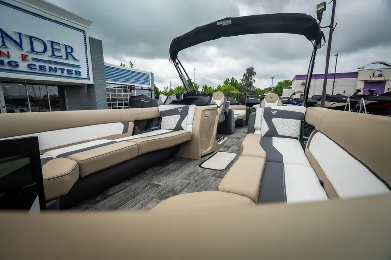 Slide: The Image of Luxurious 2026 Viaggio D26U pontoon boat with spacious seating at a boating center. - 15