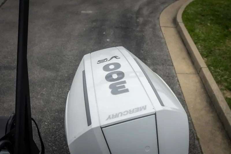 Slide: The Image of Mercury 300 outboard engine on Viaggio D26U, 2026 model, parked on asphalt road. - 25