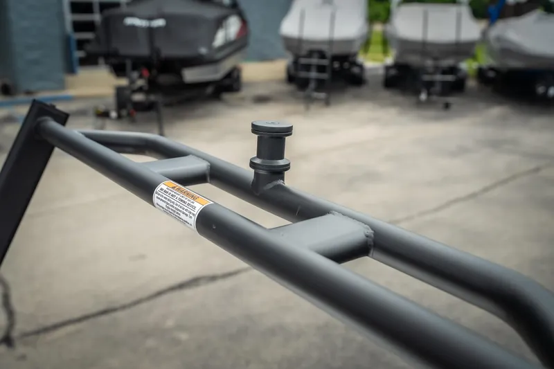 Slide: The Image of Trailer hitch detail on a 2026 Viaggio D26U, with blurred boats in the background. - 33