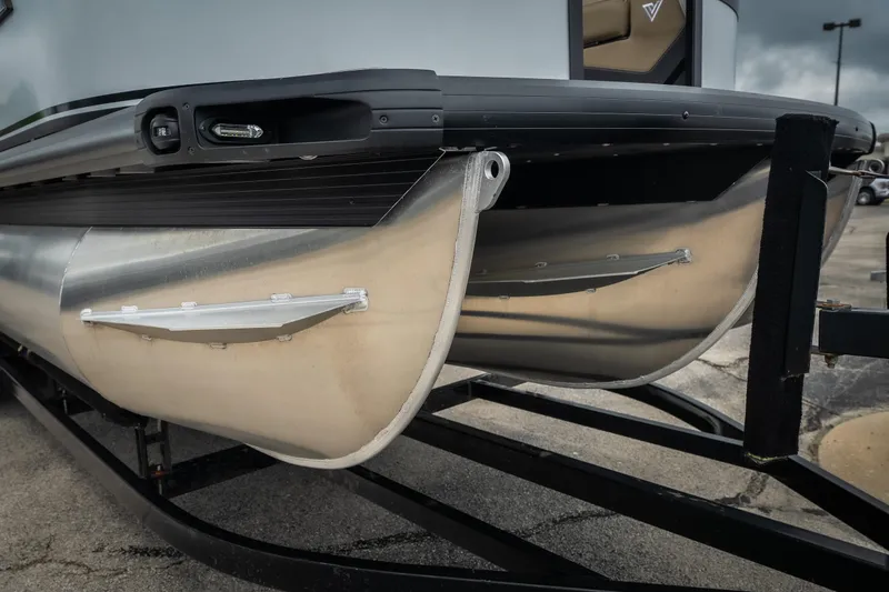 Slide: The Image of Close-up of 2026 Viaggio D26U pontoon boat on trailer, showcasing aluminum pontoons. - 4