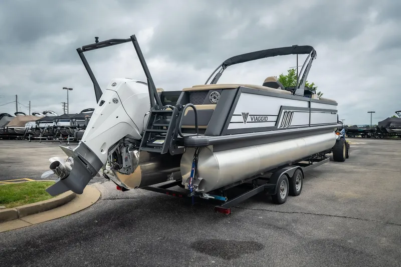 Slide: The Image of 2026 Viaggio D26U pontoon boat on trailer, featuring sleek design and powerful outboard motor. - 8