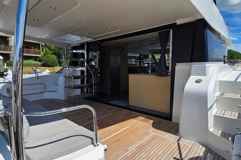 Slide: The Image of 2018 Fountaine Pajot Motor Yacht 44, featuring sleek deck and modern interior design. - 10