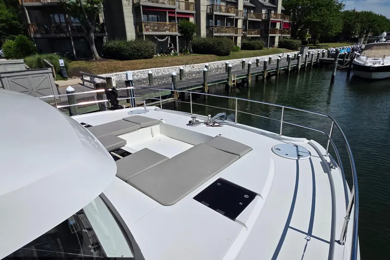 Slide: The Image of 2018 Fountaine Pajot Motor Yacht 44 docked, featuring spacious deck and seating area. - 13