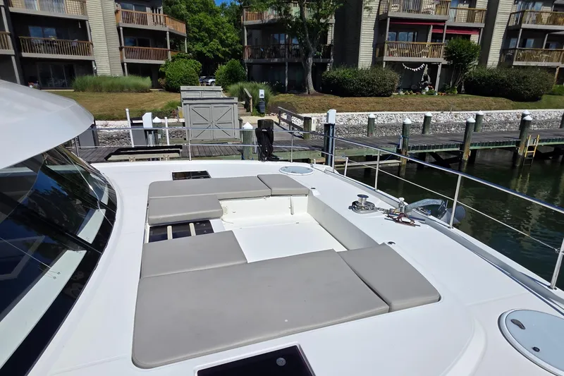 Slide: The Image of 2018 Fountaine Pajot Motor Yacht 44 docked, featuring spacious deck with cushioned seating. - 14