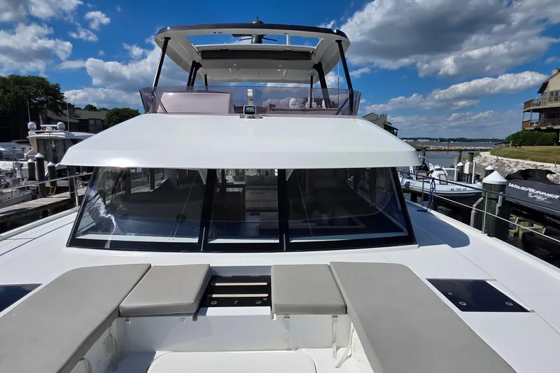 Slide: The Image of 2018 Fountaine Pajot Motor Yacht 44 docked under a clear blue sky. - 15