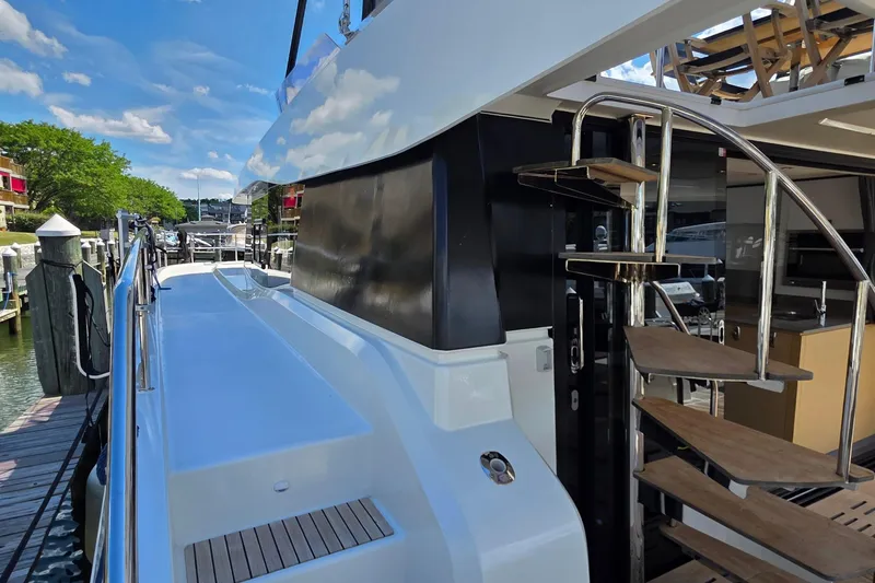 Slide: The Image of 2018 Fountaine Pajot Motor Yacht 44 with sleek deck and spiral staircase. - 17