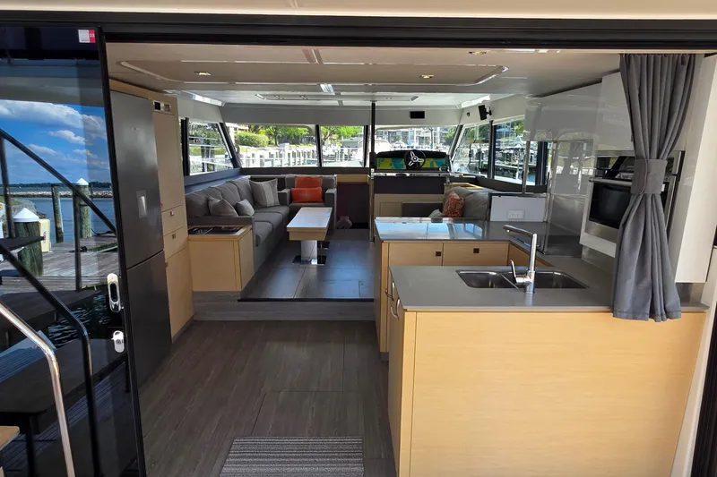 Slide: The Image of Luxurious interior of 2018 Fountaine Pajot Motor Yacht 44 with modern kitchen and seating area. - 18