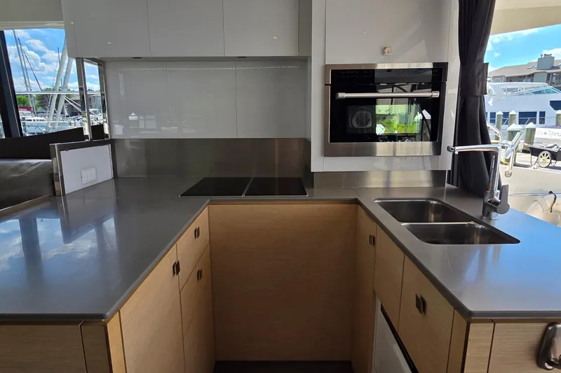 Slide: The Image of Modern kitchen interior of 2018 Fountaine Pajot Motor Yacht 44 with sleek countertops. - 20