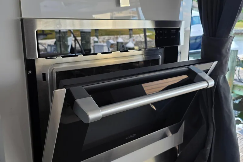 Slide: The Image of Modern kitchen appliance on 2018 Fountaine Pajot Motor Yacht 44, featuring sleek stainless steel design. - 21