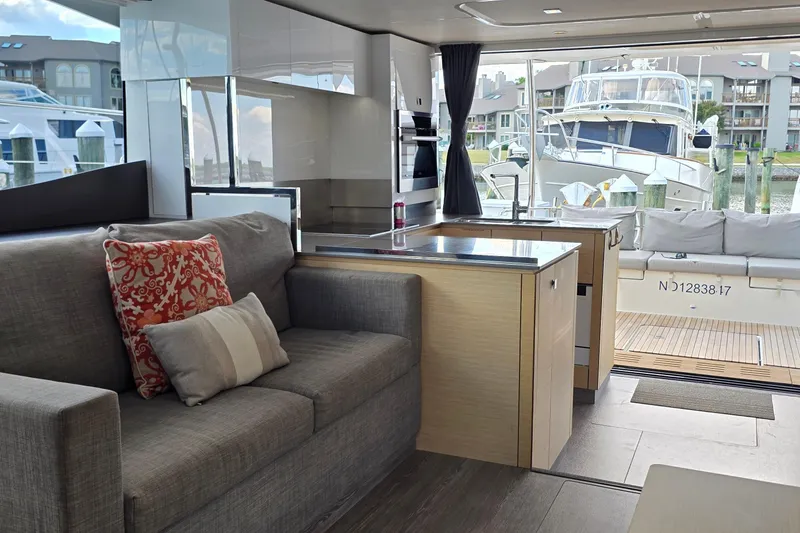 Slide: The Image of Modern interior of 2018 Fountaine Pajot Motor Yacht 44 with cozy seating and marina view. - 31