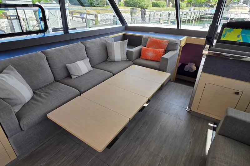 Slide: The Image of Luxurious interior of 2018 Fountaine Pajot Motor Yacht 44 with modern seating and navigation equipment. - 32