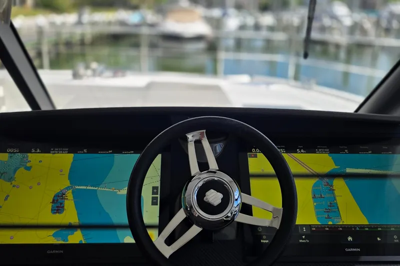 Slide: The Image of Steering wheel and navigation screens of 2018 Fountaine Pajot Motor Yacht 44. - 35