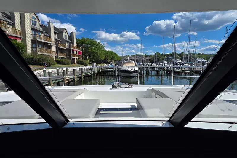 Slide: The Image of View from 2018 Fountaine Pajot Motor Yacht 44, overlooking marina and waterfront buildings. - 38