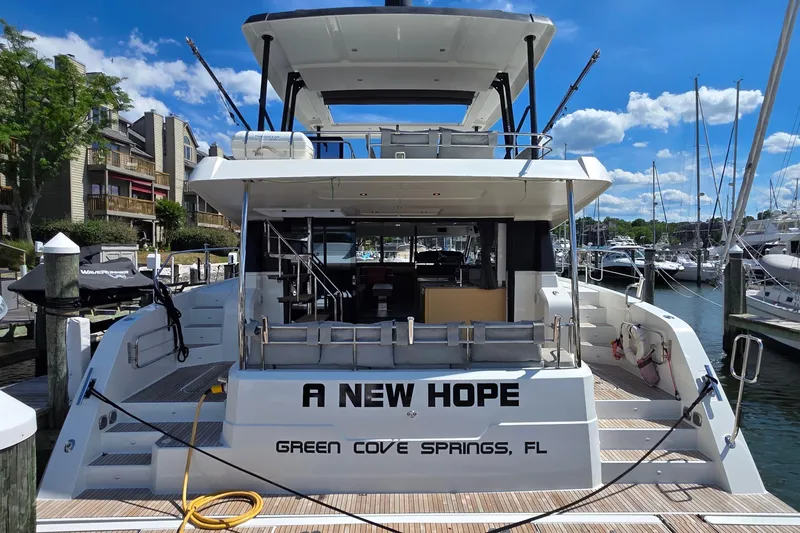 Slide: The Image of 2018 Fountaine Pajot Motor Yacht 44 docked, named "A New Hope," in Green Cove Springs, FL. - 4