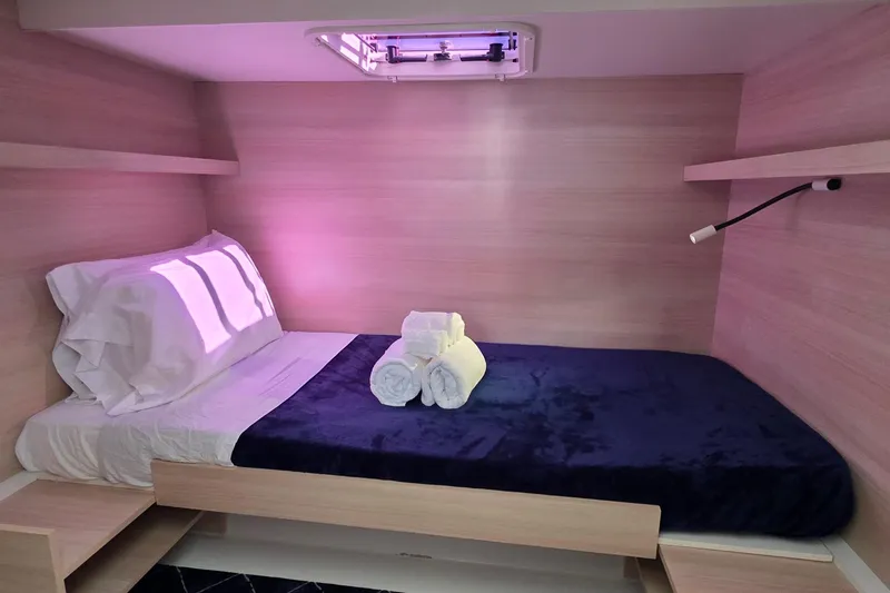 Slide: The Image of Cozy cabin interior of 2018 Fountaine Pajot Motor Yacht 44 with bed and soft lighting. - 41