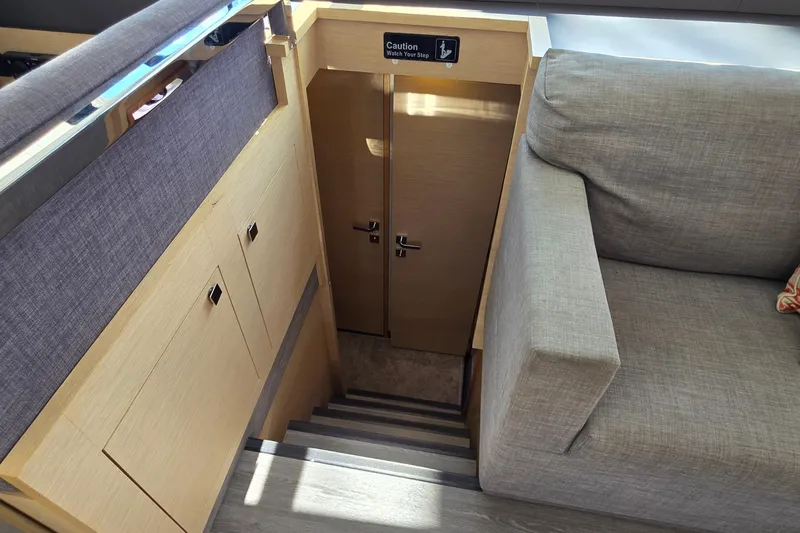 Slide: The Image of Interior stairs of 2018 Fountaine Pajot Motor Yacht 44, featuring modern design and cozy seating. - 43