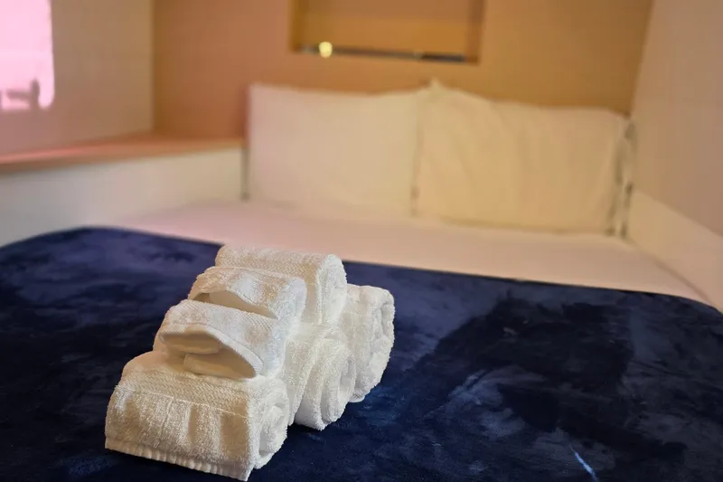 Slide: The Image of Luxurious cabin interior of 2018 Fountaine Pajot Motor Yacht 44 with neatly folded towels. - 45